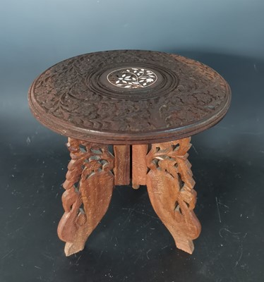 Lot 32 - A small Indian carved wood table with inlaid...