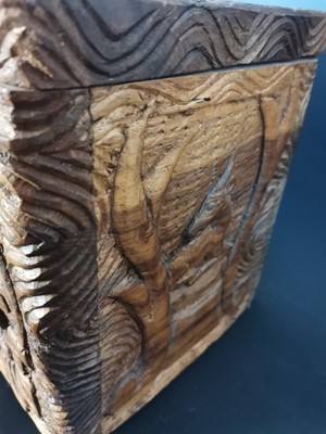 Lot 20 - A decoratively hand carved African wooden box...