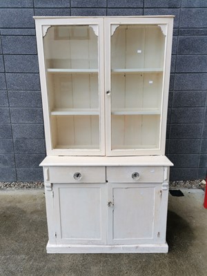 Lot 16 - A white painted pine dresser with glazed doors,...