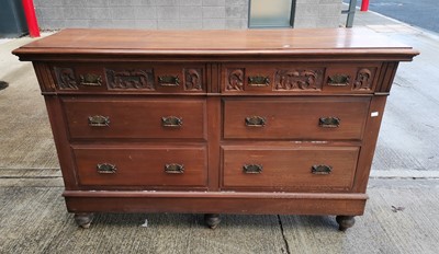 Lot 17 - A continental sideboard with a carved motif,...