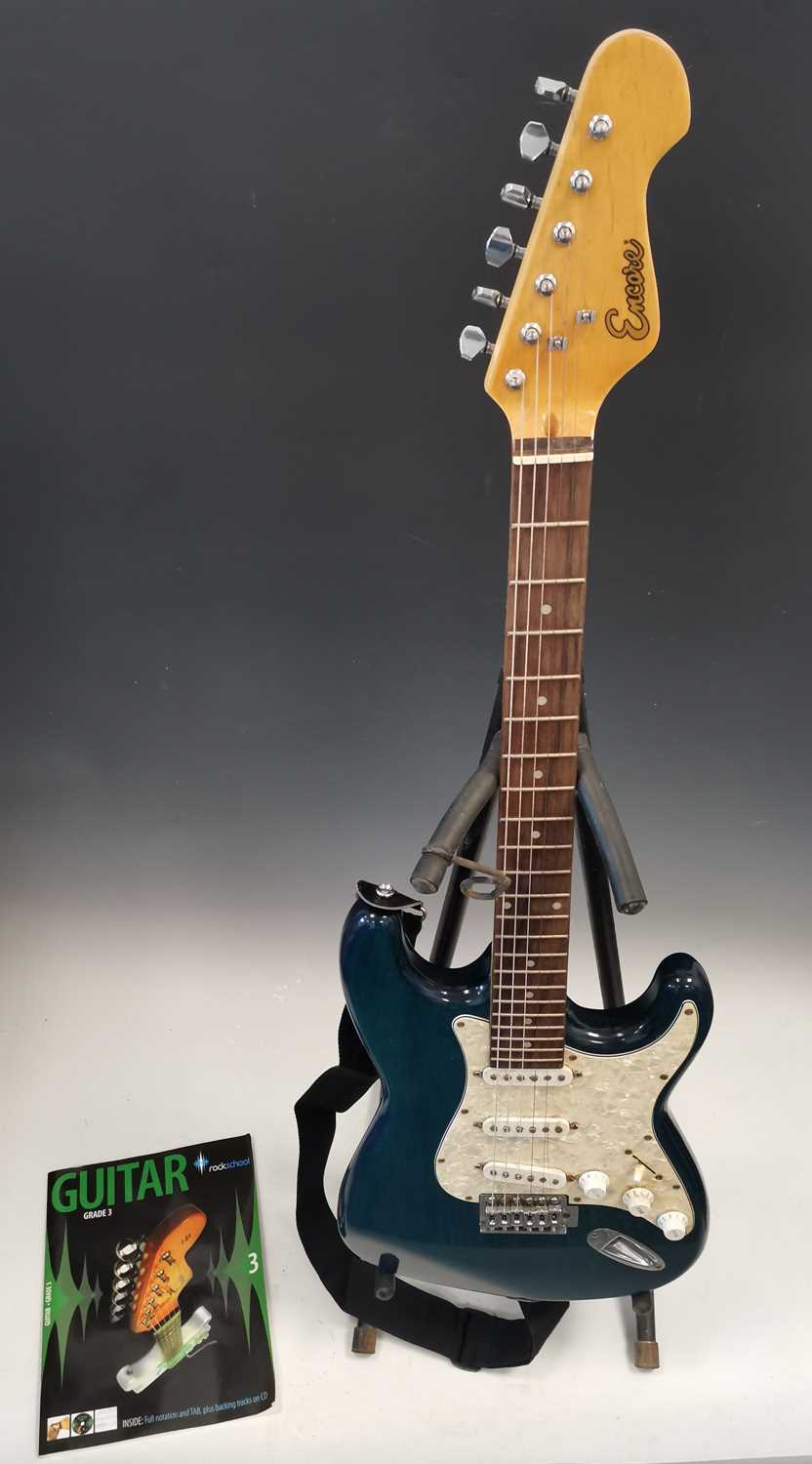 Lot 13 - A blue Encore Stratocaster style electric...