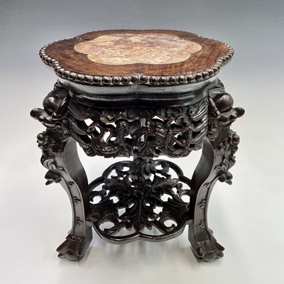 Lot 159 - A Chinese carved hardwood jardiniere stand,...