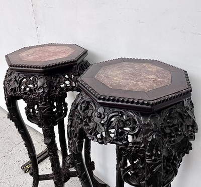 Lot 45 - A pair of Chinese carved hardwood jardiniere...