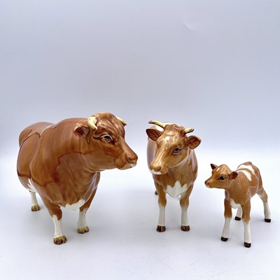 Lot 941 - Three Beswick models of Guernsey cattle,...