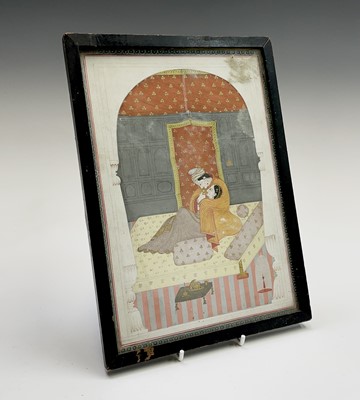 Lot 1018 - An Indian painting of a couple in a romantic...