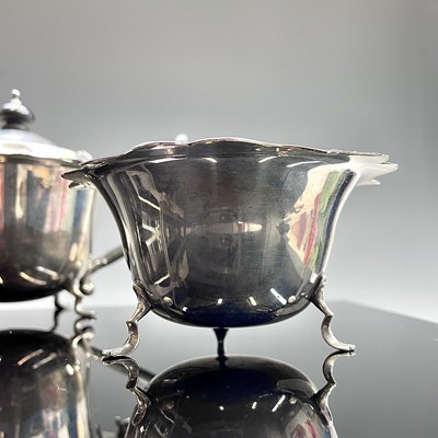 Lot 104 - A George V bachelors three-piece silver tea...