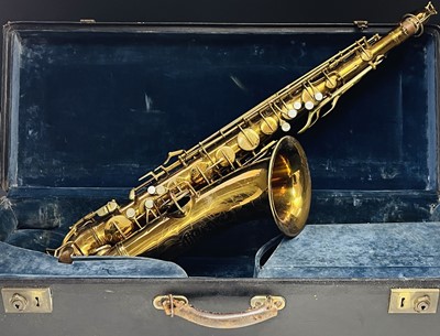 Lot 458 - A gilt lacquered tenor saxophone, by C.G.Conn,...