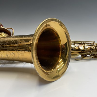 Lot 458 - A gilt lacquered tenor saxophone, by C.G.Conn,...
