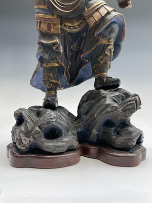 Lot 53 - A large Chinese carved wood figure of a...