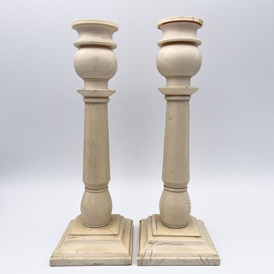 Lot 1008 - A pair of Anglo-Indian ivory candlesticks,...