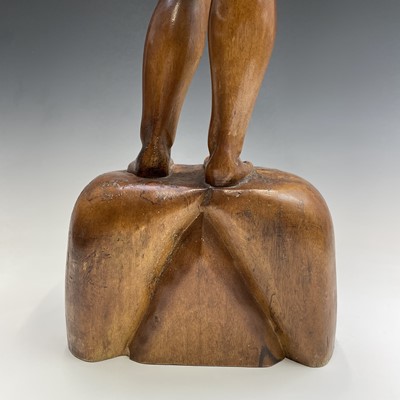 Lot 229 - A carved wooden figure of a standing female...