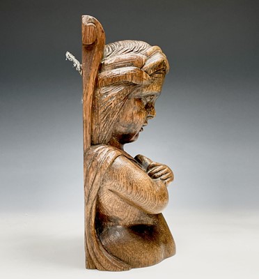 Lot 289 - A carved oak half length female figure on a...