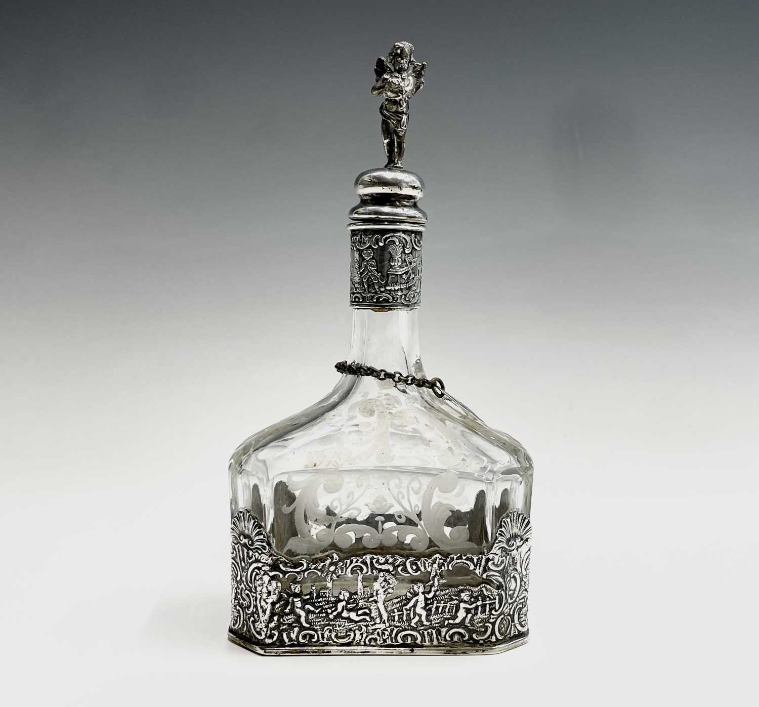 Lot 37 - A Dutch glass decanter with cast silver base...