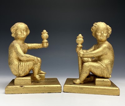 Lot 366 - A pair of cast iron figures modelled as seated...