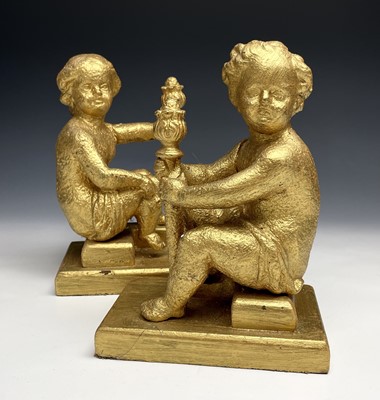 Lot 366 - A pair of cast iron figures modelled as seated...