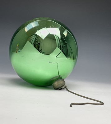 Lot 350 - A 20th century green glass witch ball. Maximum...