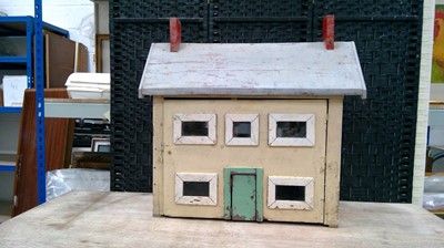 Lot 14 - A vintage wooden dolls house. height 67cm and...