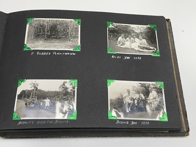 Lot 30 - A black Japanned photograph album depicting...