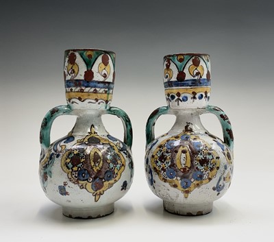 Lot 1023 - Two similar Moroccan pottery twin-handled...