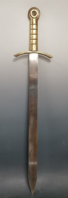 Lot 4 - A steel sword with a brass hilt. Length 73cm.