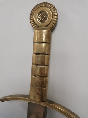 Lot 4 - A steel sword with a brass hilt. Length 73cm.