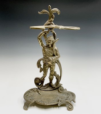 Lot 147 - A brass umbrella stand cast with a male figure....