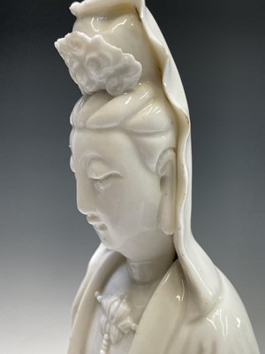 Lot 23 - A large Chinese blanc de chine figure of a...