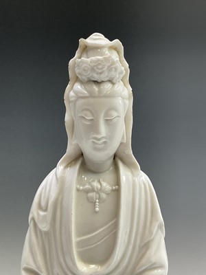 Lot 23 - A large Chinese blanc de chine figure of a...