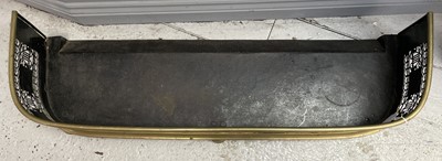 Lot 111 - An early Victorian brass fender, pierced with...