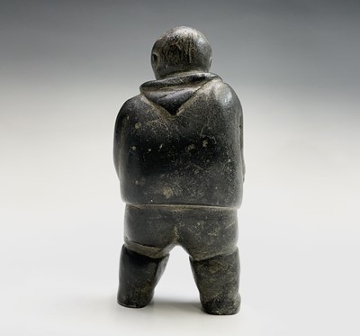 Lot 184 - An Inuit and carved stone figure, probably...