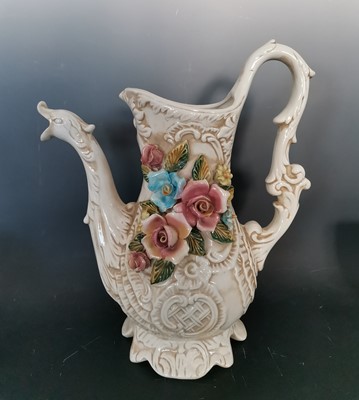 Lot 12 - A large Italian capodimonte pitcher. Height:...