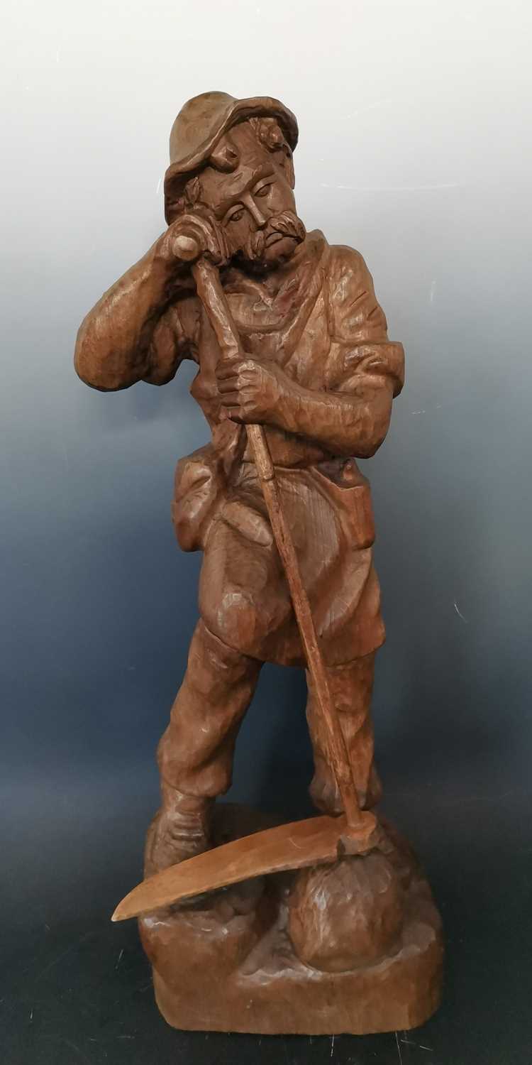 Lot 9 - A Black Forest wood carving figurine of a...