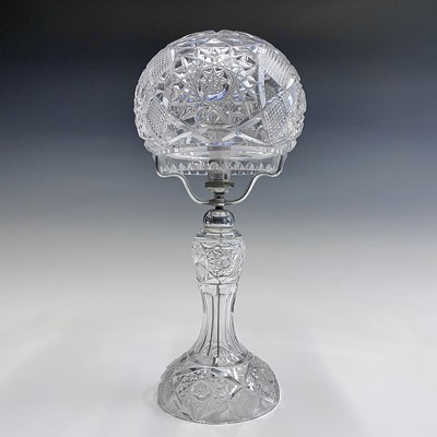 Lot 943 - A cut glass table lamp and shade, with hobnail...