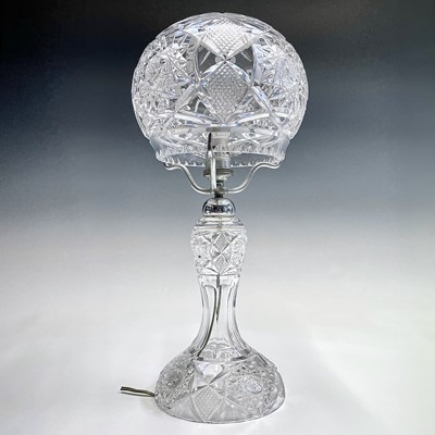 Lot 943 - A cut glass table lamp and shade, with hobnail...