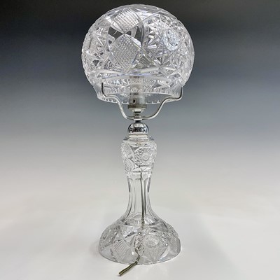 Lot 943 - A cut glass table lamp and shade, with hobnail...