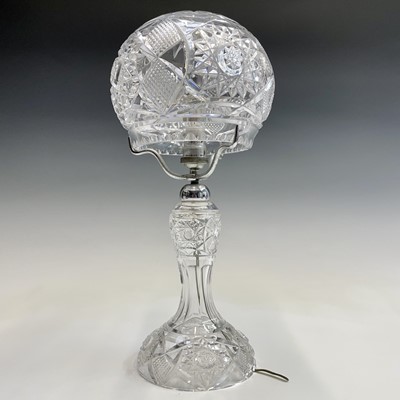 Lot 943 - A cut glass table lamp and shade, with hobnail...