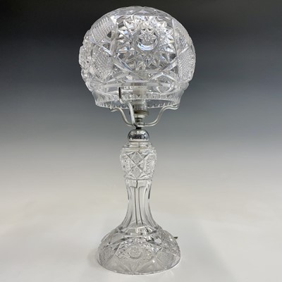 Lot 943 - A cut glass table lamp and shade, with hobnail...