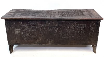 Lot 91 - A carved oak sword chest dated 1664, height 54....