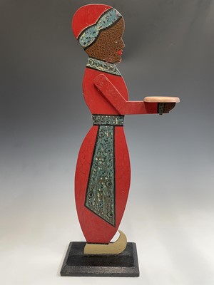 Lot 120 - A figural painted wood dumb waiter. Height 77cm.