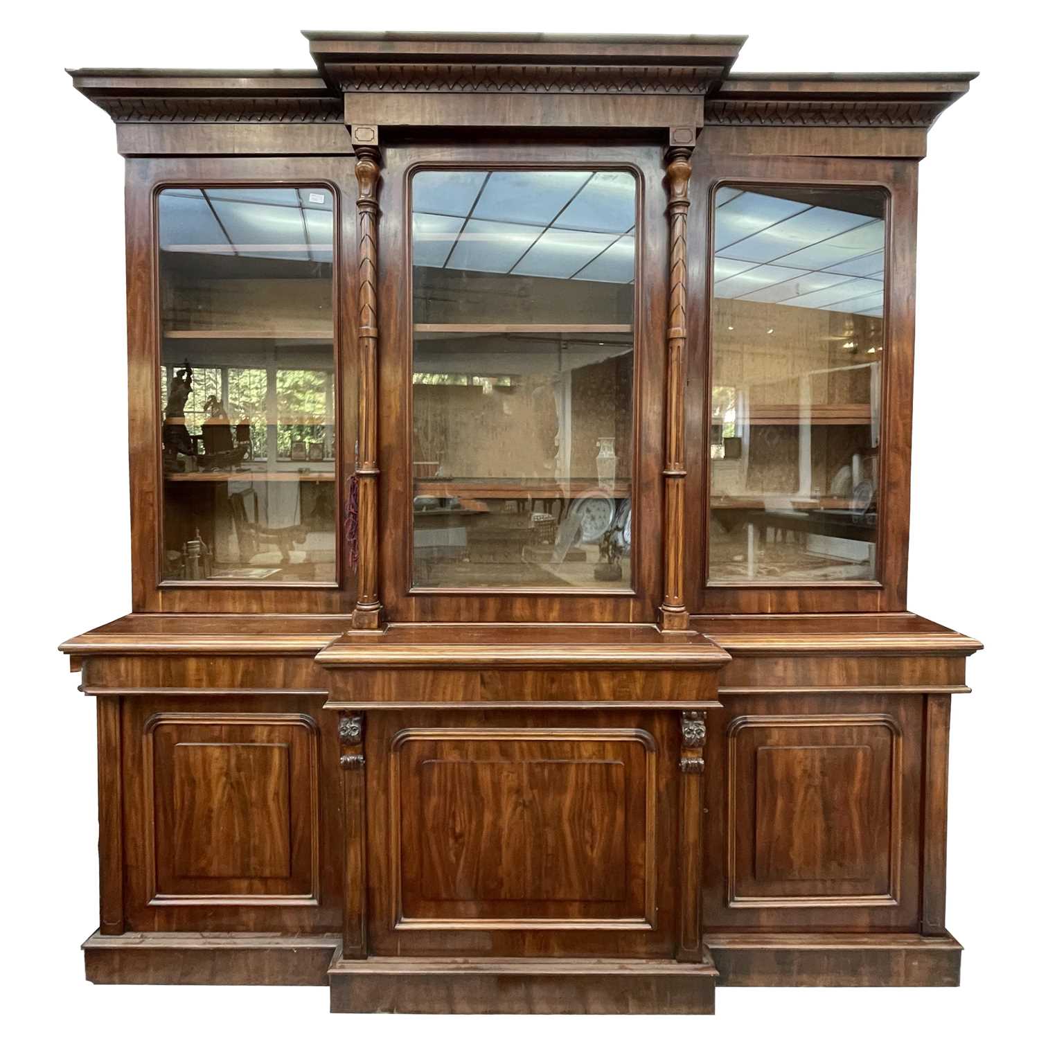 Lot 3136 - A large Victorian mahogany breakfront bookcase,...