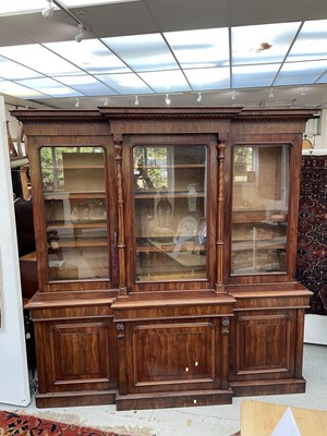 Lot 3136 - A large Victorian mahogany breakfront bookcase,...