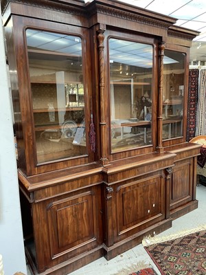 Lot 3136 - A large Victorian mahogany breakfront bookcase,...