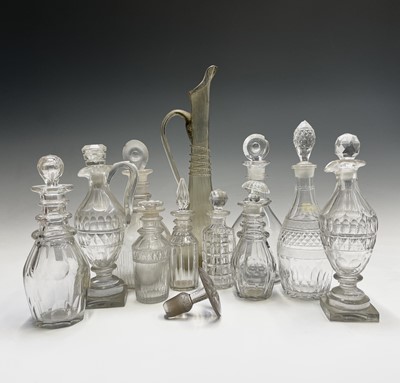 Lot 946 - Two Georgian triple ring neck glass decanters...