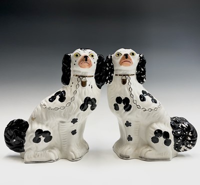 Lot 948 - A pair of reproduction Staffordshire flatback...