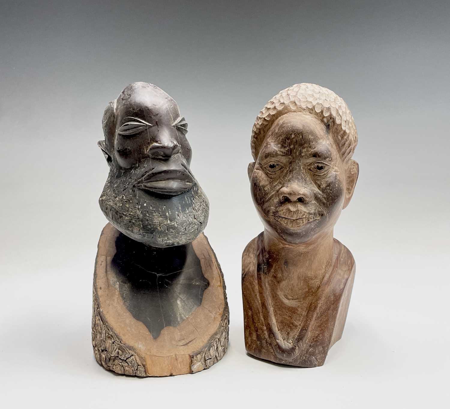 Lot 208 - An African carved wood head and shoulders bust...
