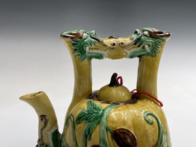 Lot 26 - A Chinese sancai-glazed teapot, the spout and...