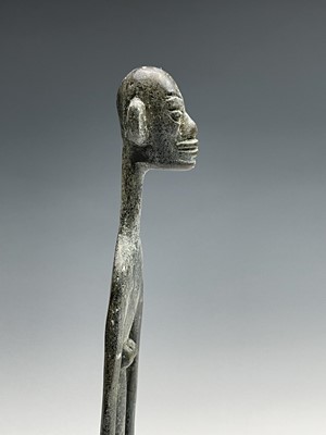 Lot 209 - An African bronze figure of elongated form,...