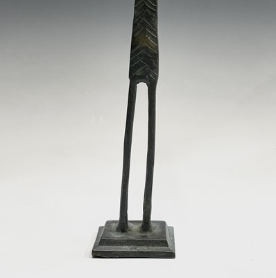 Lot 209 - An African bronze figure of elongated form,...