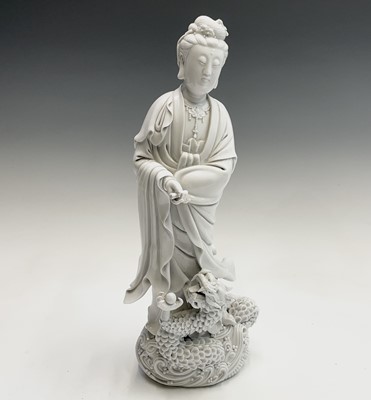 Lot 225 - A Chinese blanc de chine figure of Guanyin,...