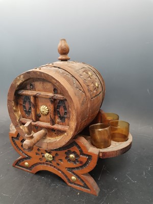 Lot 41 - A decoratively carved Spanish cask barrel and...